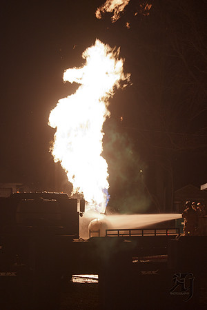 Two teams move in to put out a propane tank fire